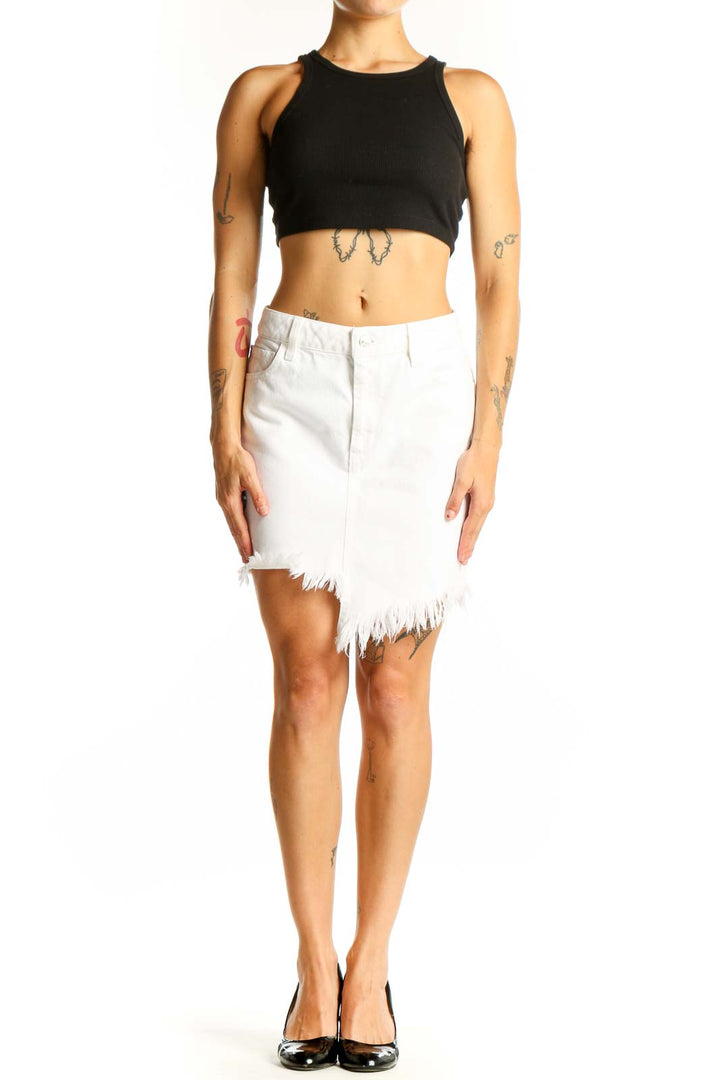 Front view of white distressed denim mini skirt by Guess