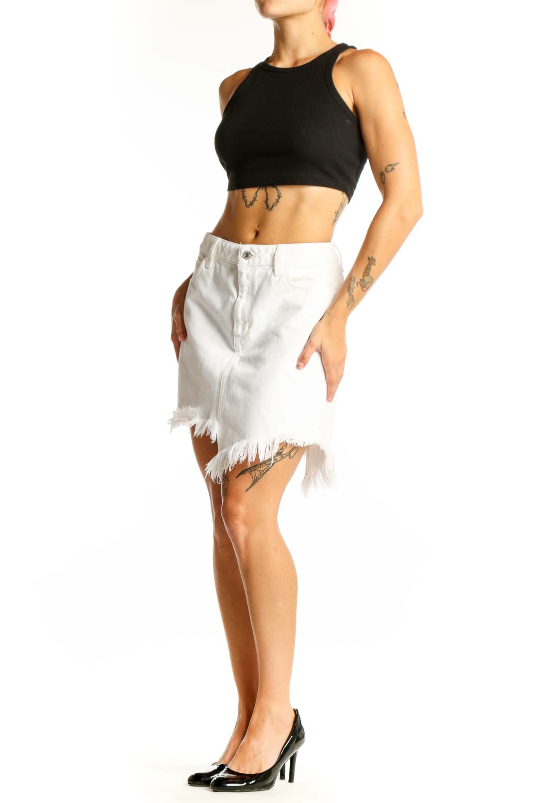 Front view of white distressed denim mini skirt by Guess