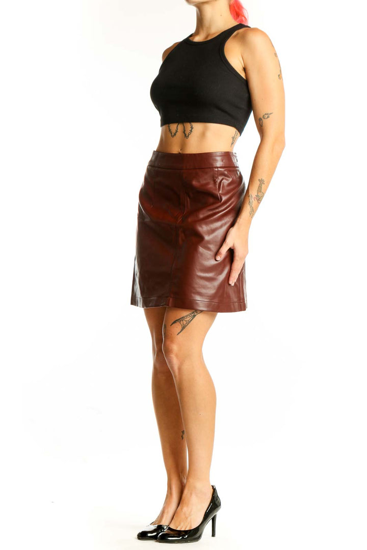 Front view of French Connection brown faux leather mini skirt