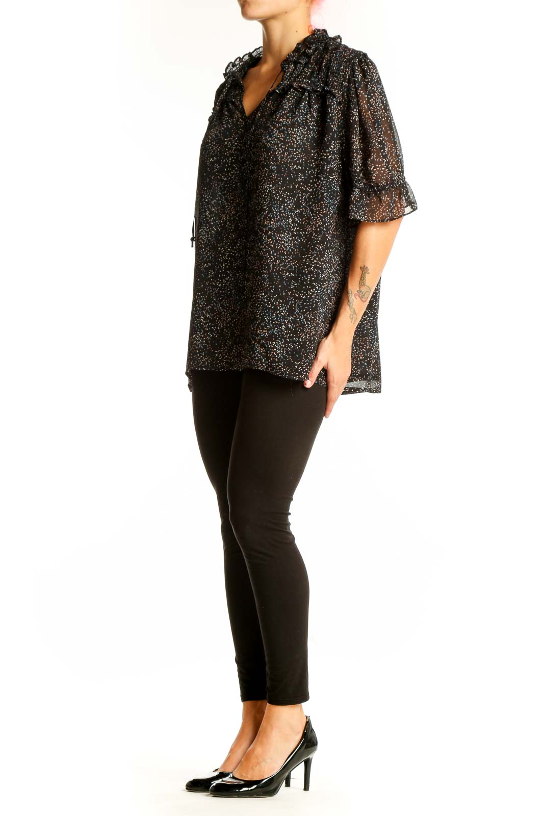 Front view of Pleione black speckled sheer blouse with ruffle-neck