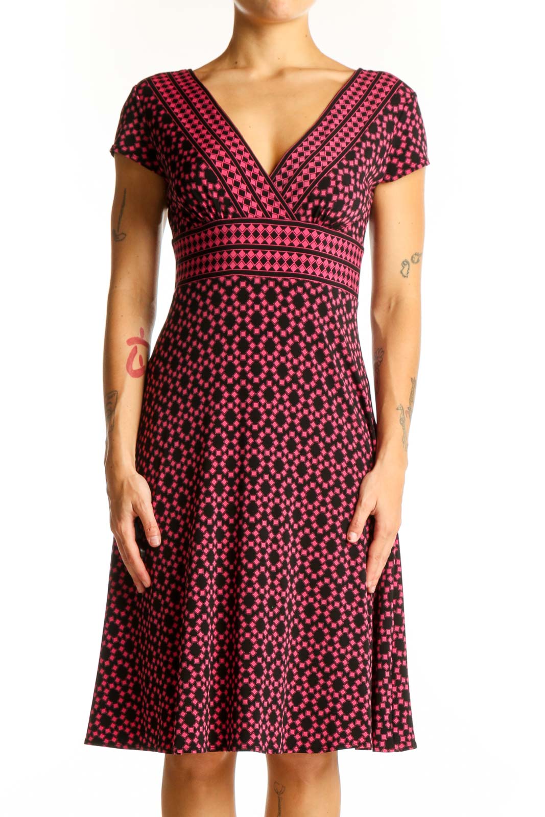 Front view of Maggy London pink polka dot V-neck midi dress