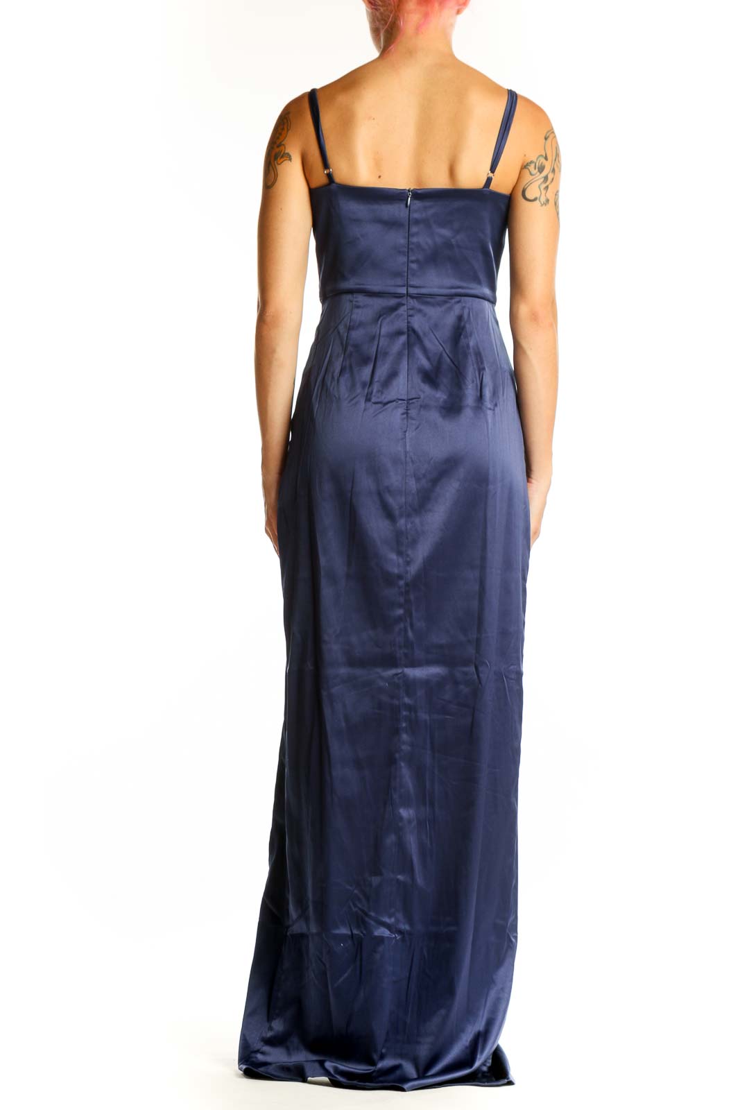 Side view of navy satin maxi dress showing high slit and fitted silhouette