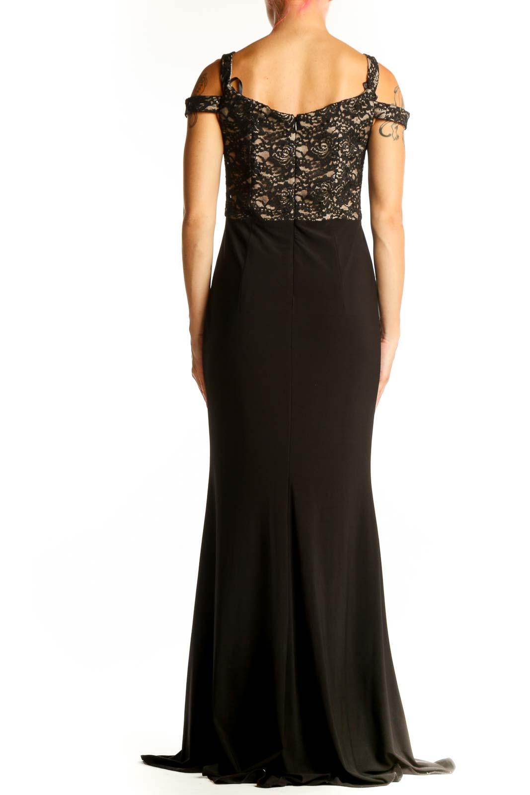 Back view of black lace Xscape evening gown showing full-length silhouette