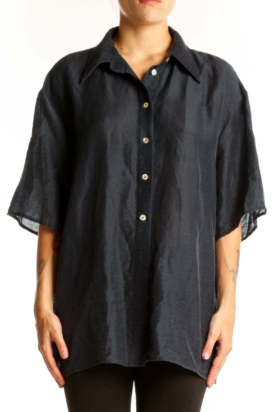 Front view of black oversized button-down shirt from Mango