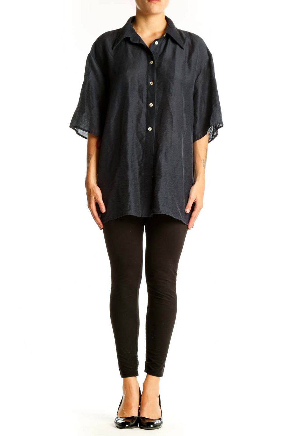 Front view of black oversized button-down shirt from Mango