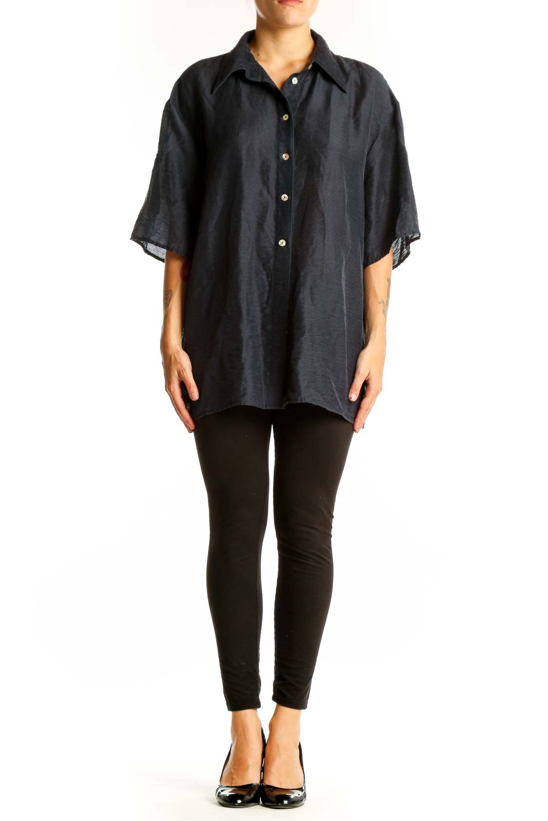 Front view of black oversized button-down shirt from Mango