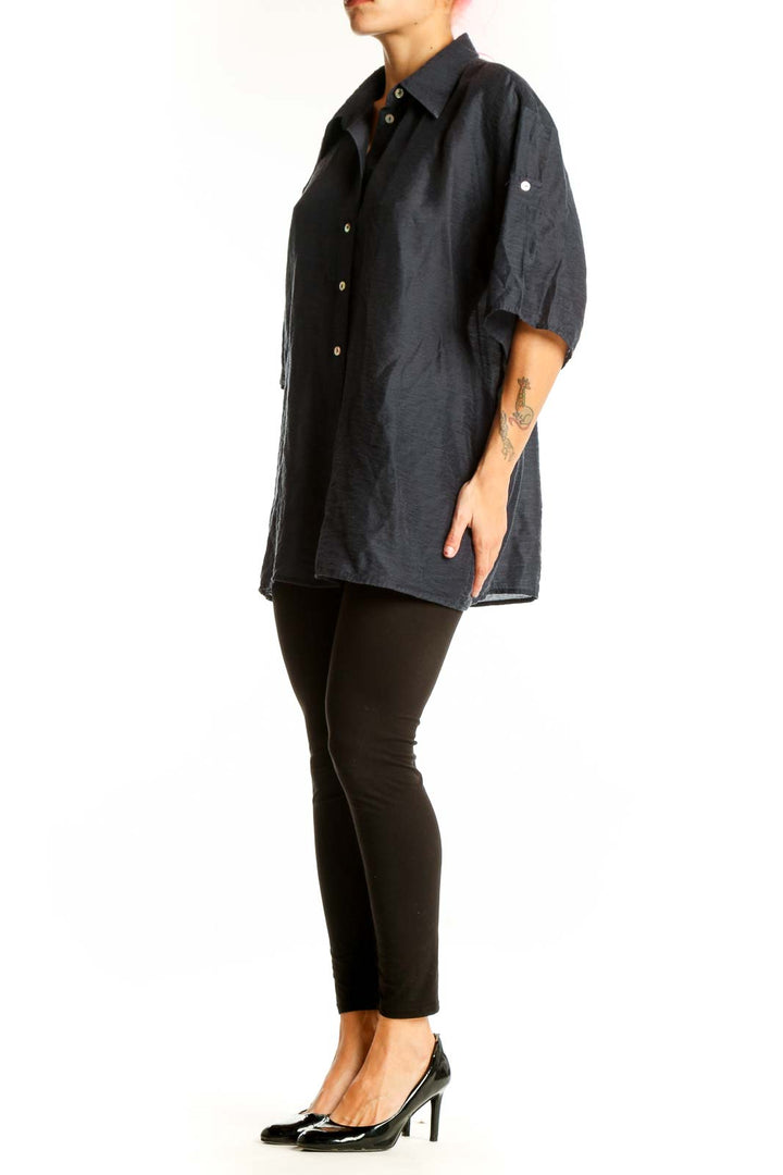 Front view of black oversized button-down shirt from Mango