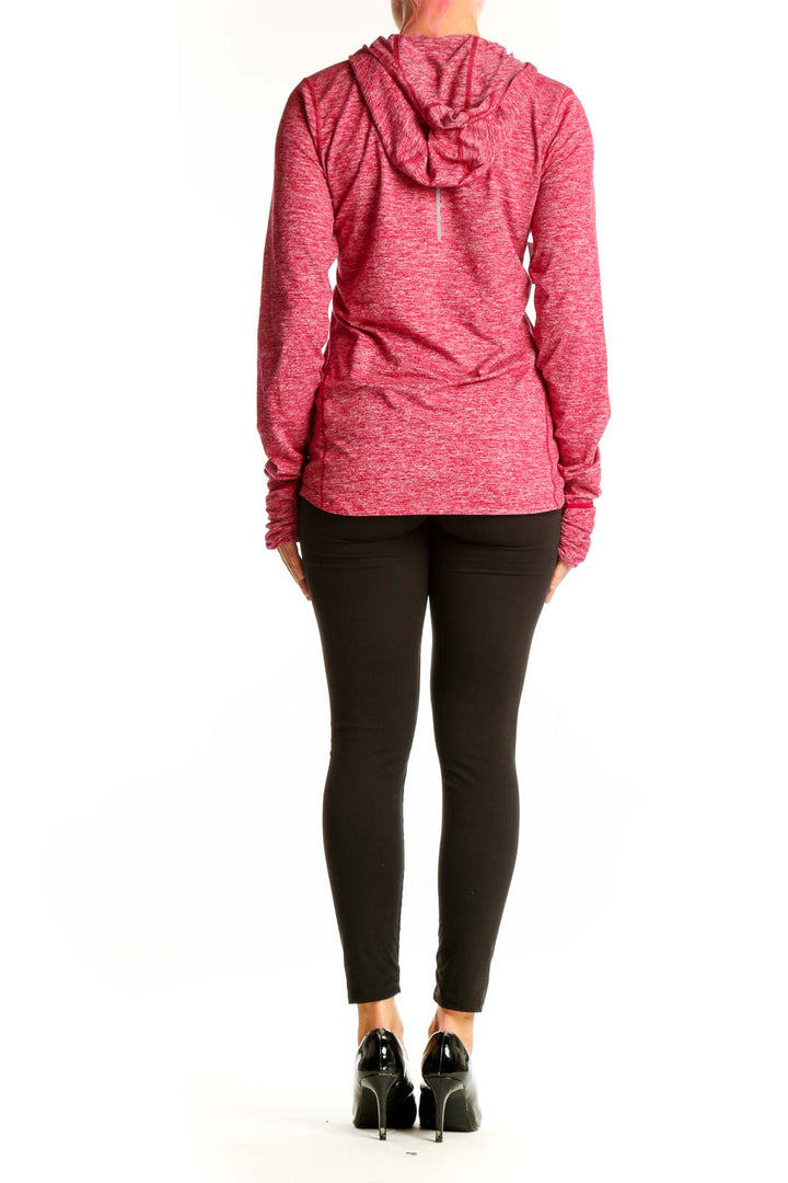Back view of pink heathered Nike performance hoodie on model