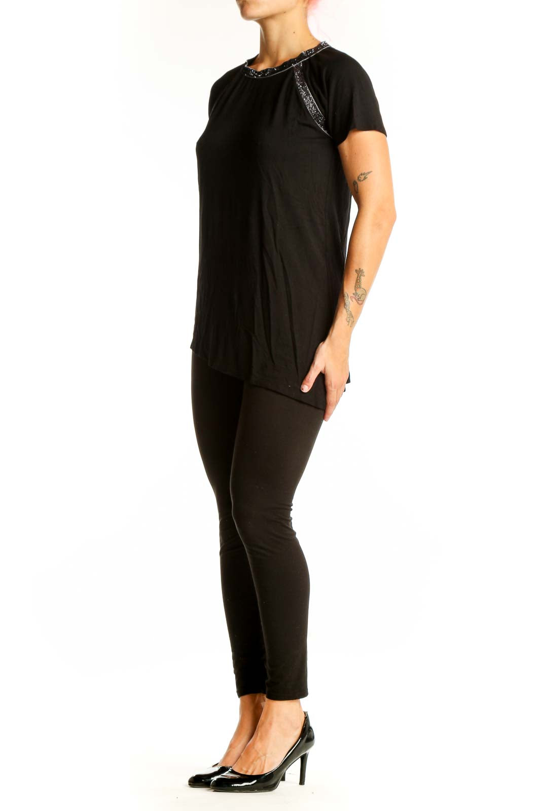 Front view of Design History black asymmetrical short sleeve top with sparkle trim