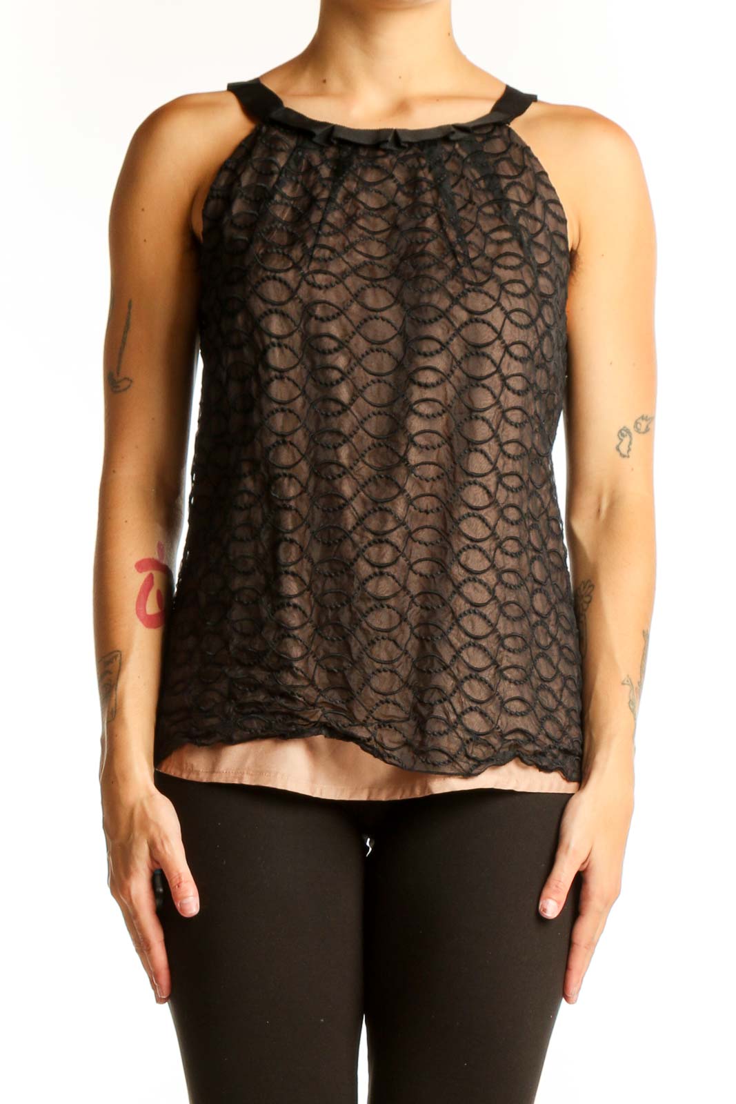 Front view of Kenar Black Lace Overlay Sleeveless Top with nude underlay