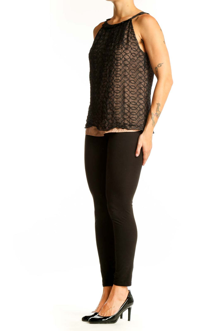 Front view of Kenar Black Lace Overlay Sleeveless Top with nude underlay