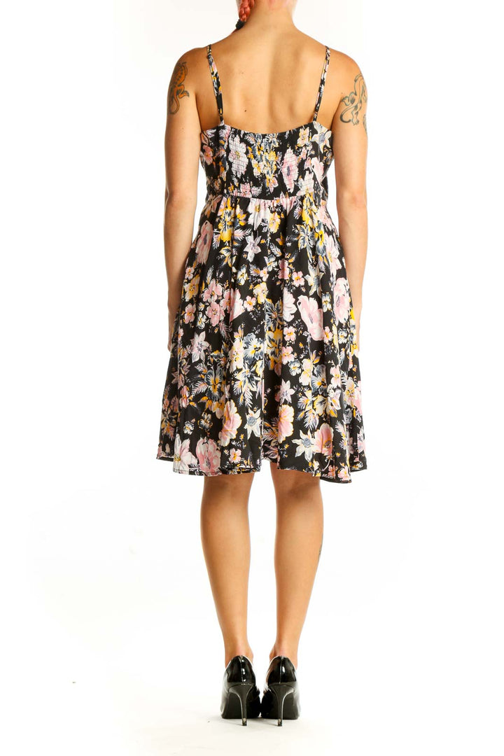 Back view of black floral Gap dress showing A-line silhouette and all-over floral print