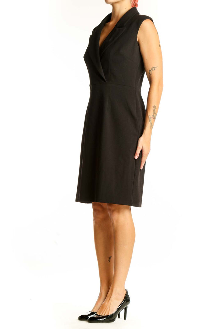 Front view of Donna Morgan black sleeveless wrap dress on model