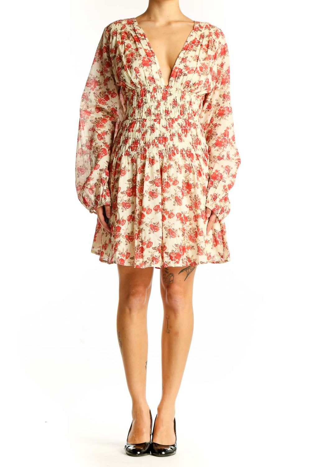 Front view of cream Free People mini dress with red floral print and V-neckline