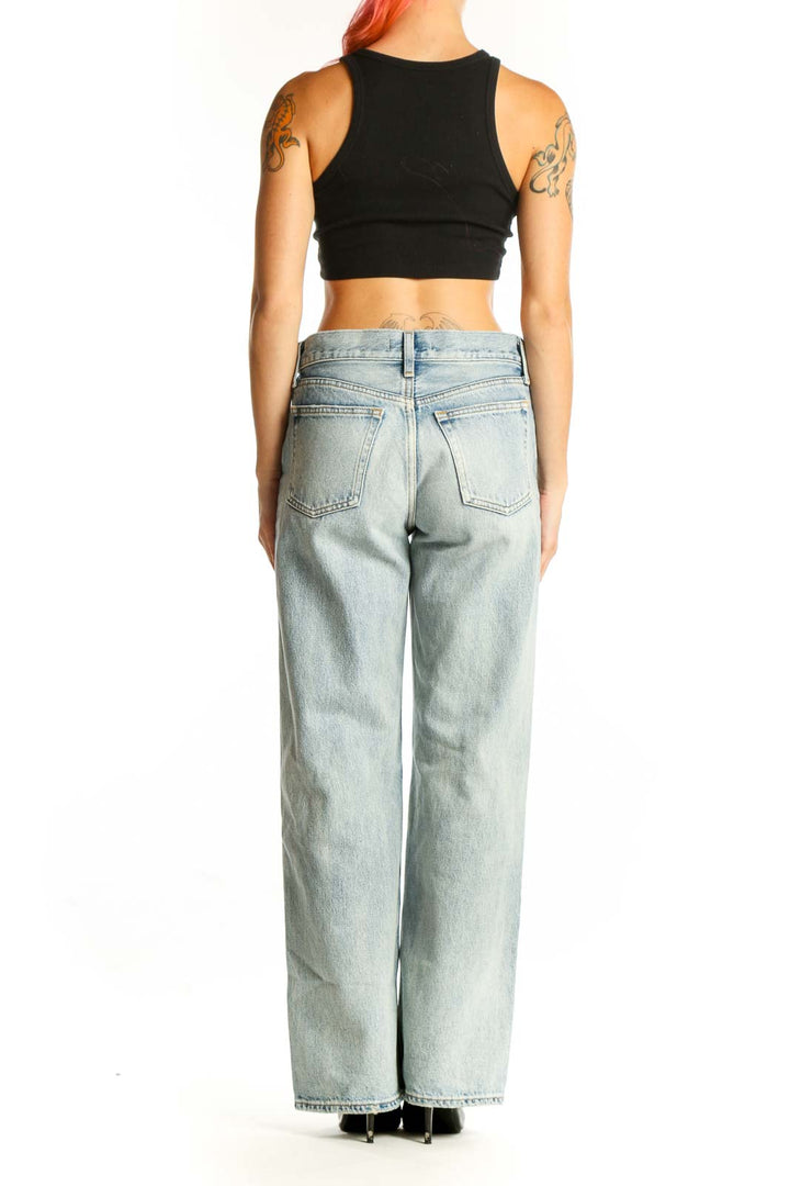 Back view of Moussy light blue wide-leg denim jeans on model