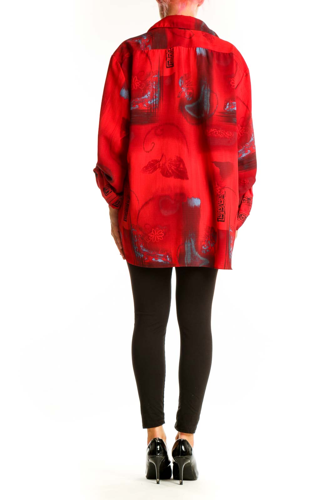 Side view of red floral print oversized button-down shirt on model