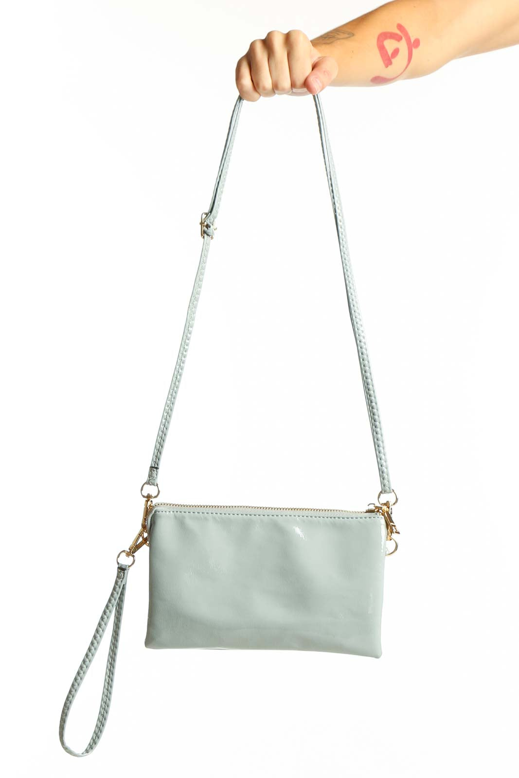 Mint green compact crossbody bag with adjustable strap