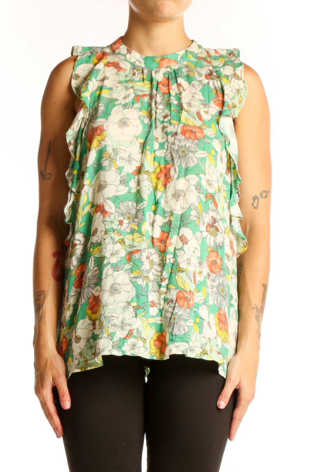 Front view of Anthropologie green floral sleeveless top with ruffle details