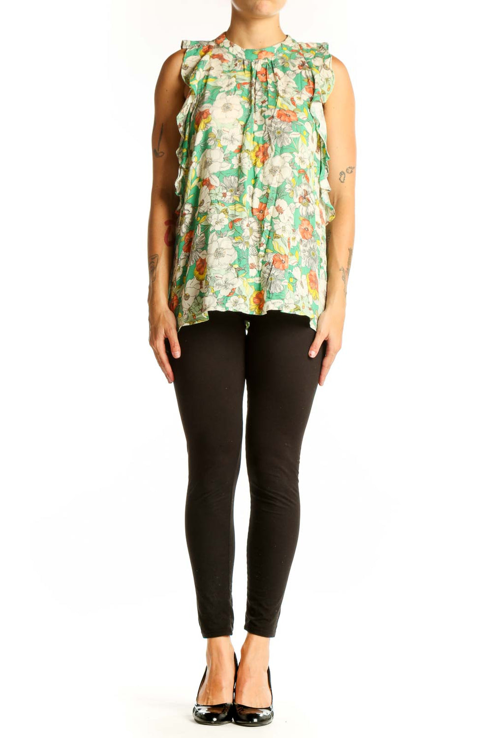 Front view of Anthropologie green floral sleeveless top with ruffle details