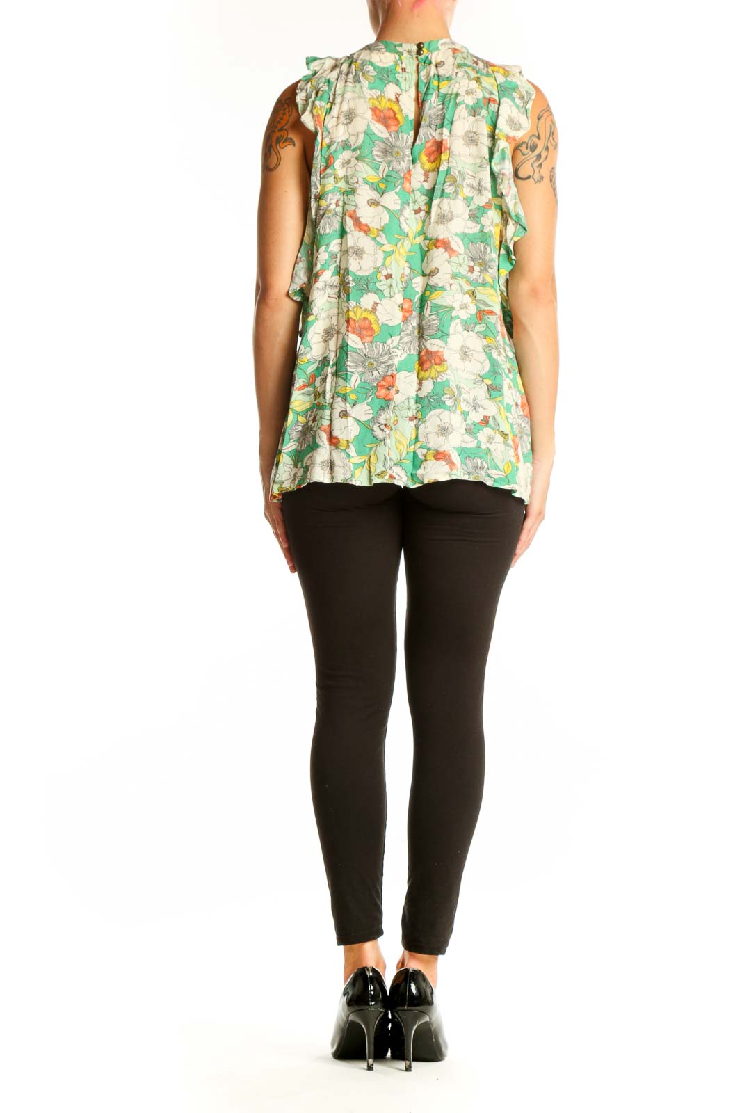 Side view of Anthropologie green floral sleeveless top showing relaxed fit