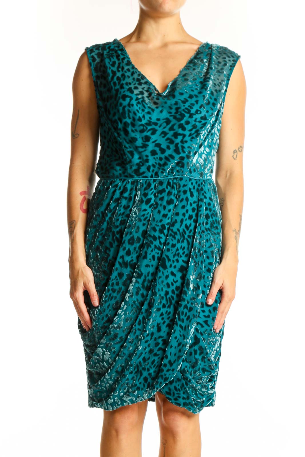 Front view of teal leopard print velvet cocktail dress with V-neck and wrap style