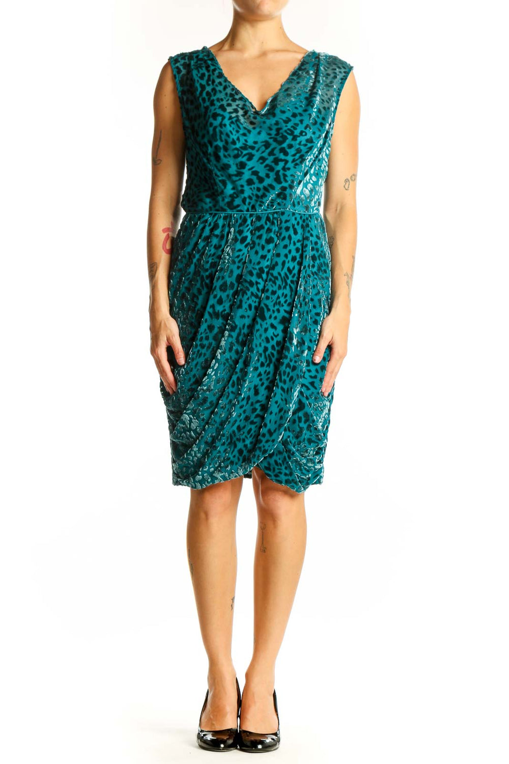 Front view of teal leopard print velvet cocktail dress with V-neck and wrap style