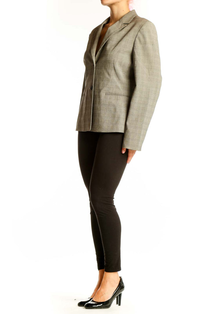 Front view of Casual Corner gray plaid blazer with notched lapels and two-button closure