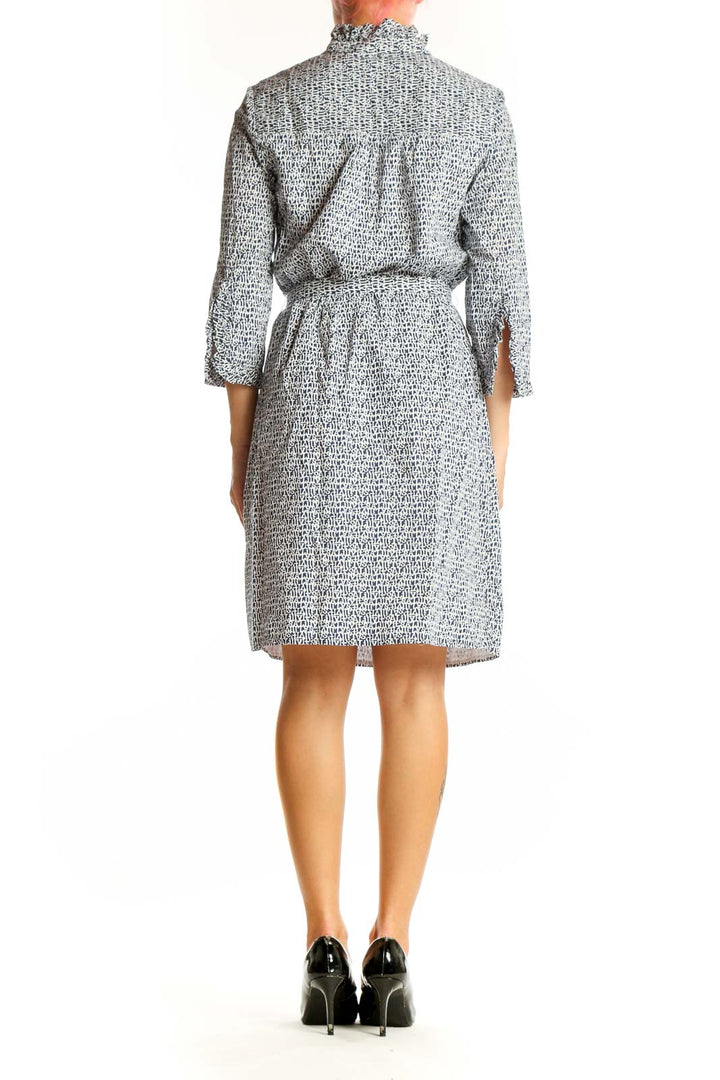 Side view of Lily Pulitzer gray patterned cotton shirt dress showing cinched waist