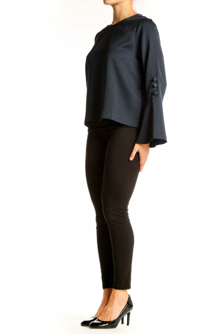 Front view of Vince Camuto navy blouse with bell sleeves
