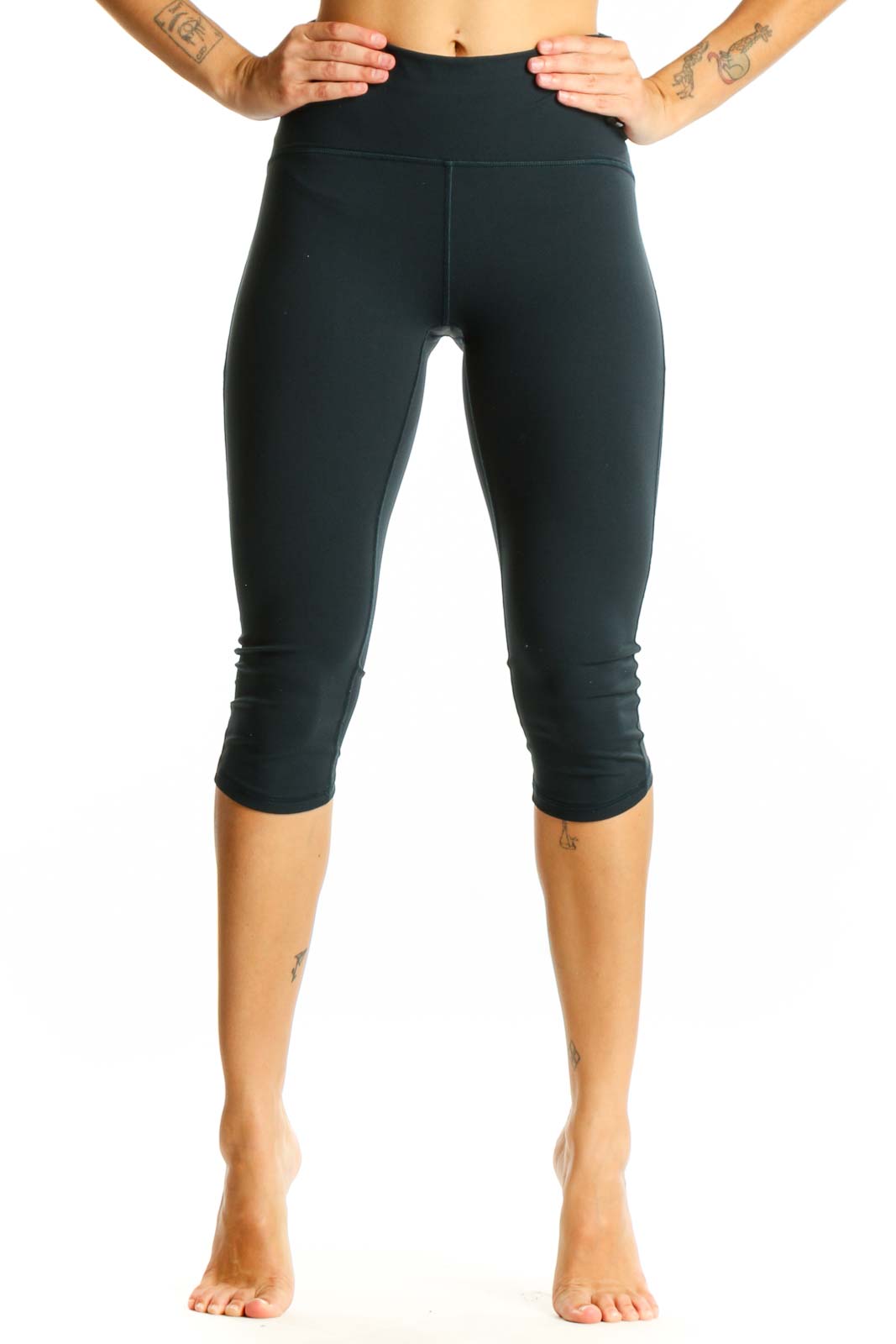 Front view of Lululemon dark green high-waisted capri leggings