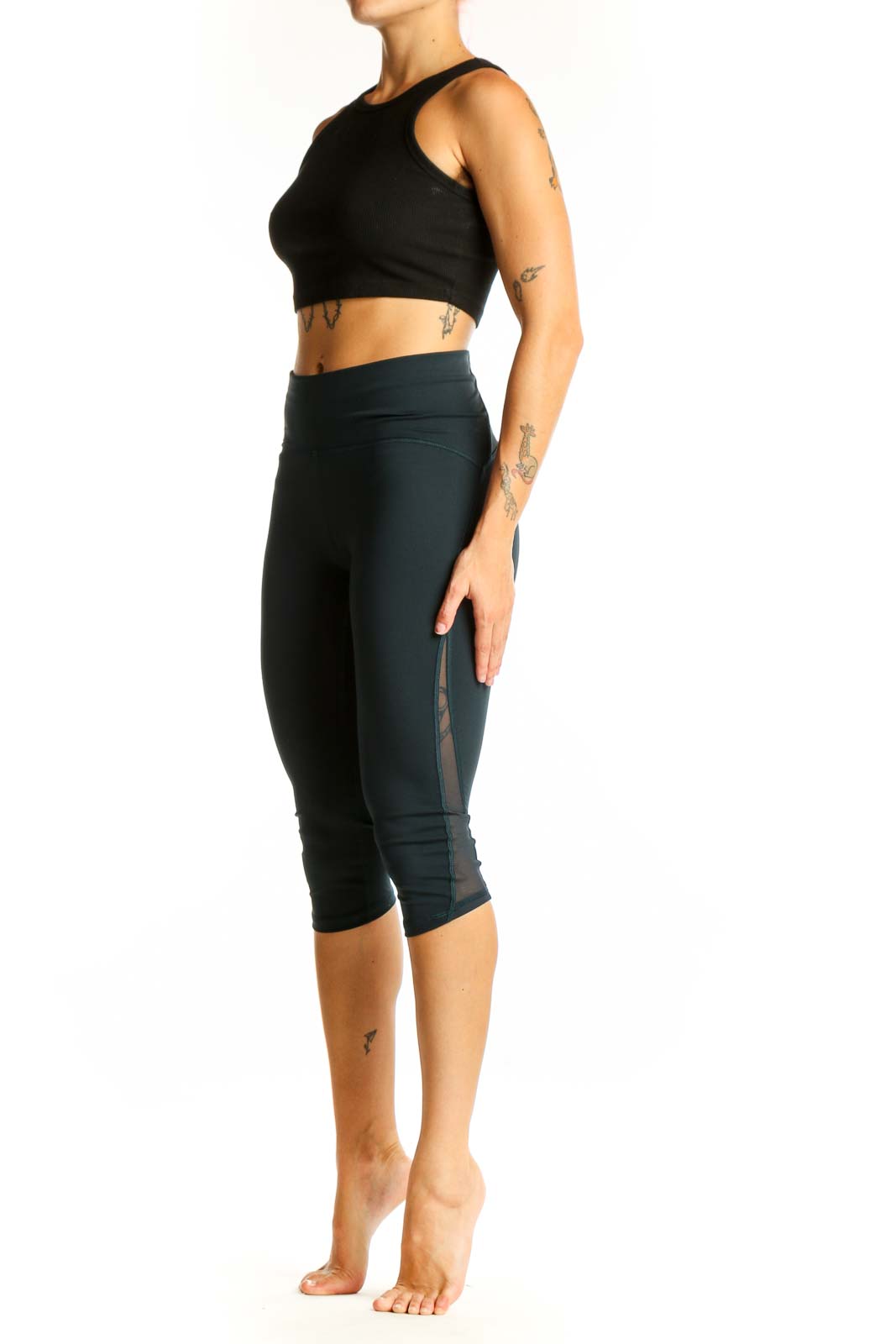 Front view of Lululemon dark green high-waisted capri leggings