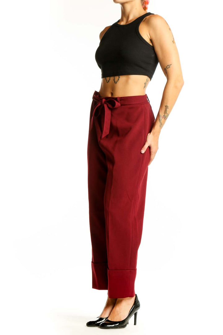 Front view of burgundy wide-leg trousers with tie belt from Club Monaco