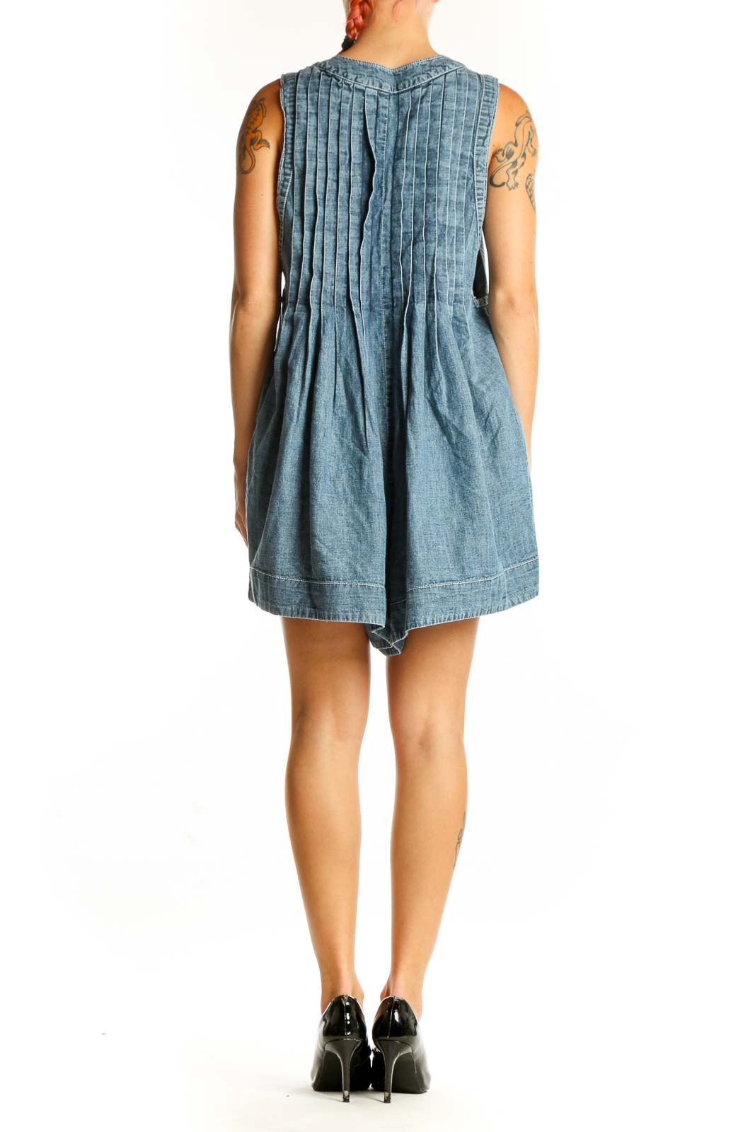 Side view of Free People Blue Denim Pleated V-Neck Romper showing relaxed fit
