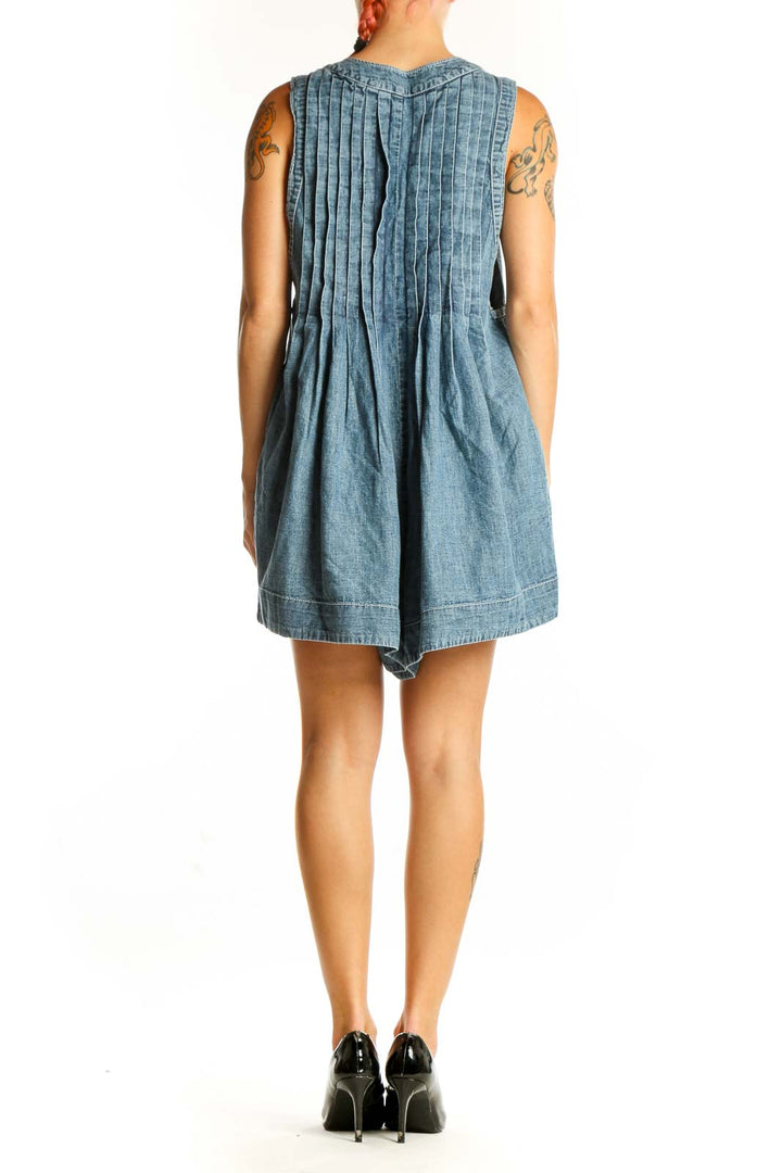 Side view of Free People Blue Denim Pleated V-Neck Romper showing relaxed fit