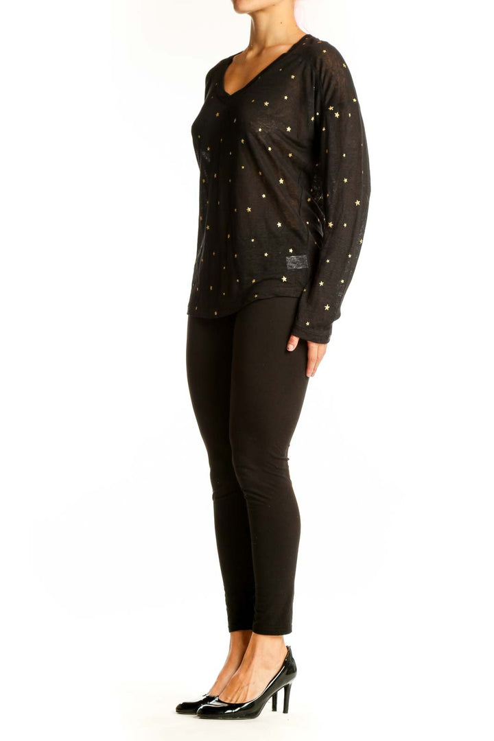 Front view of Rails black long-sleeve top with gold star prints and V-neckline