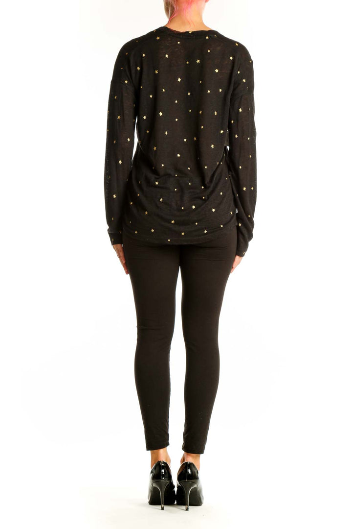 Side view of Rails black star-printed long-sleeve top on model