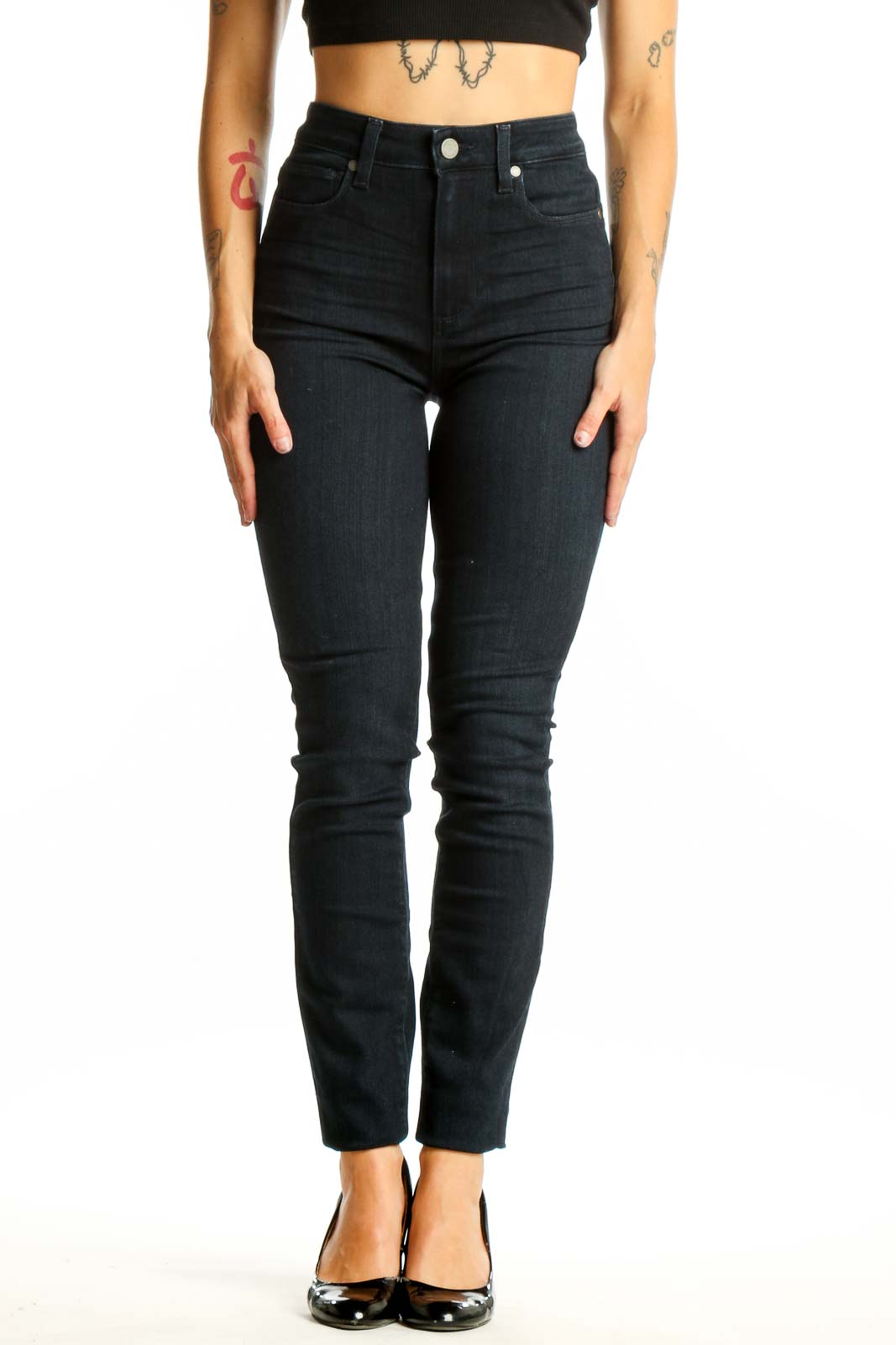 Front view of Paige dark blue high-waisted skinny jeans on model