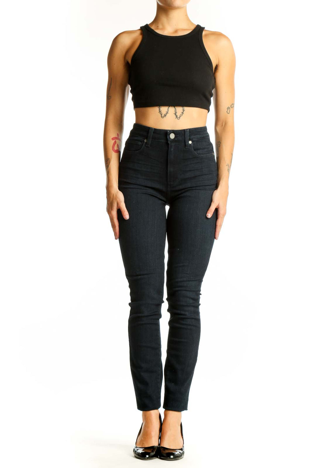 Front view of Paige dark blue high-waisted skinny jeans on model
