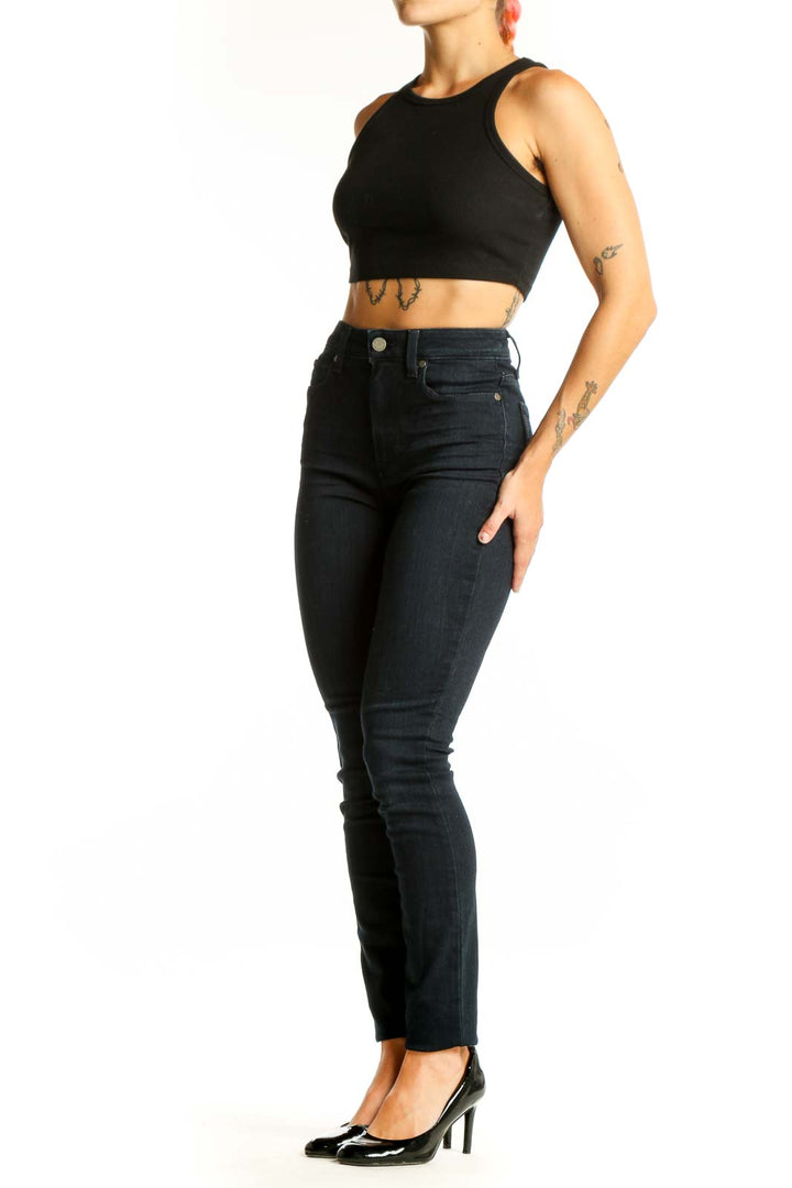 Front view of Paige dark blue high-waisted skinny jeans on model