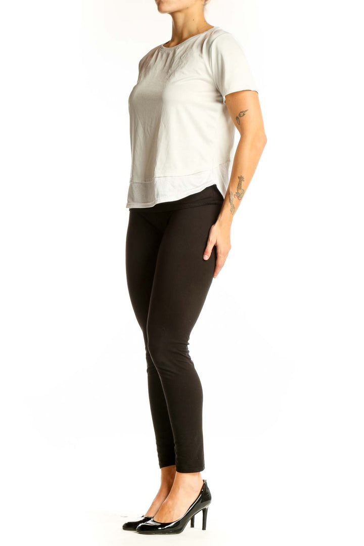 Front view of white HeatGear athletic top with short sleeves