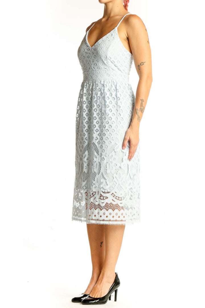 Front view of light blue lace midi dress with eyelet pattern