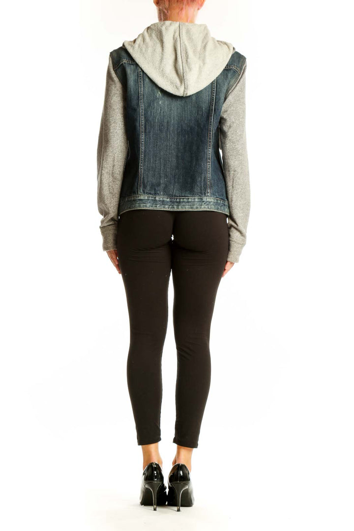 Side view of Express denim jacket showing contrast between denim body and knit sleeves
