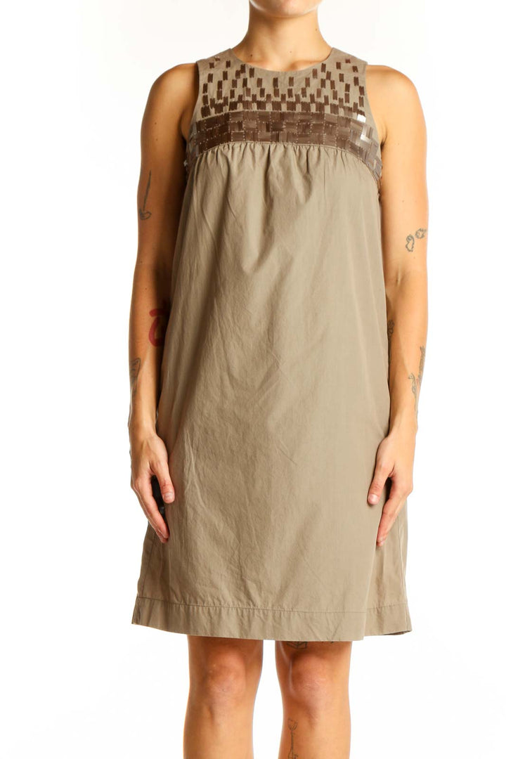 Front view of Vince beige cotton sleeveless shift dress with geometric yoke pattern