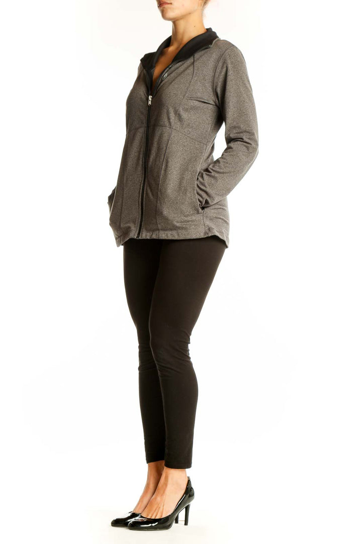 Front view of gray Reebok athletic zip-up jacket