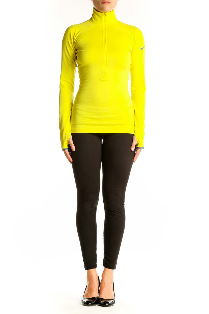 Front view of yellow Nike high-neck half-zip athletic top