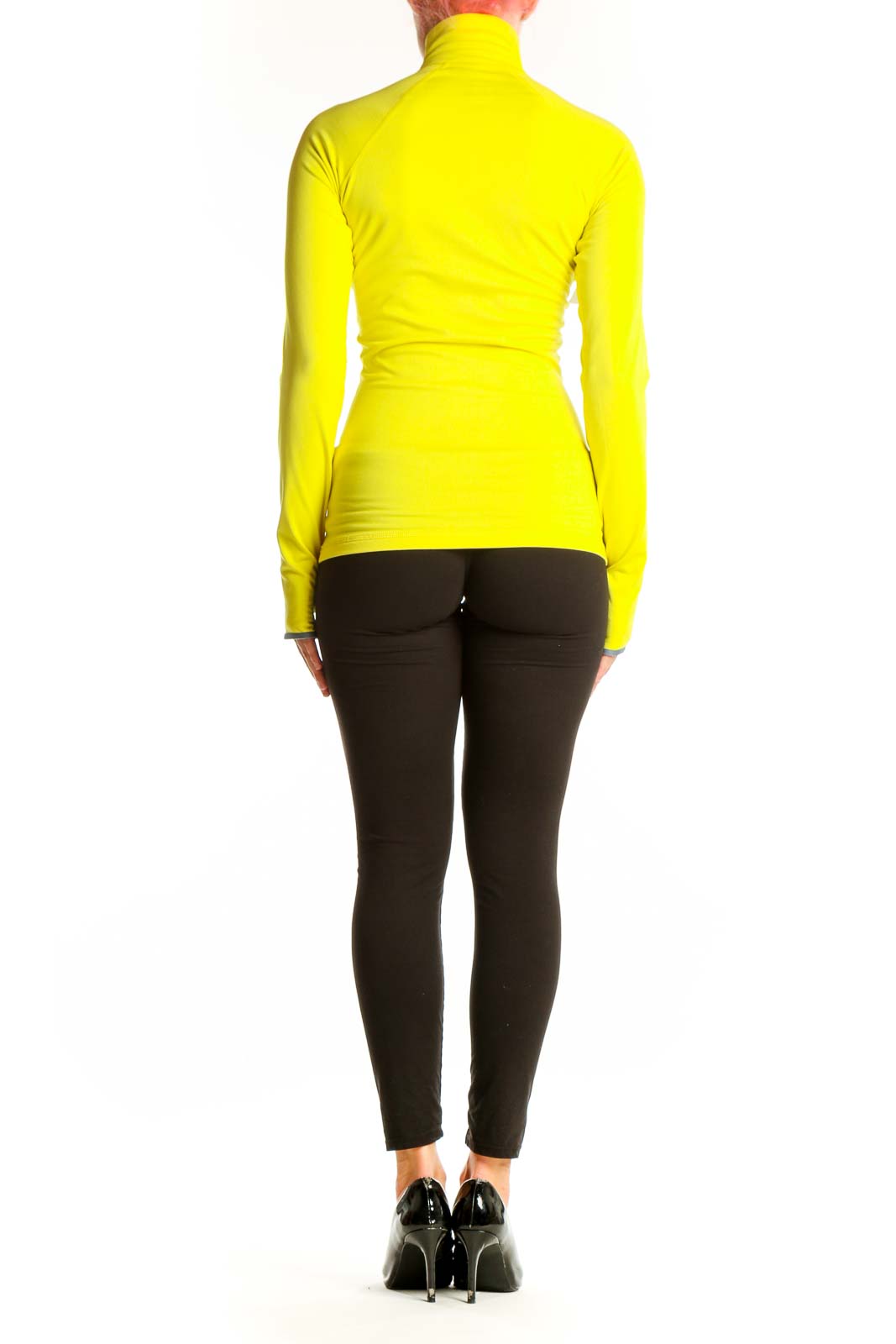 Side view of yellow Nike high-neck half-zip athletic top on model