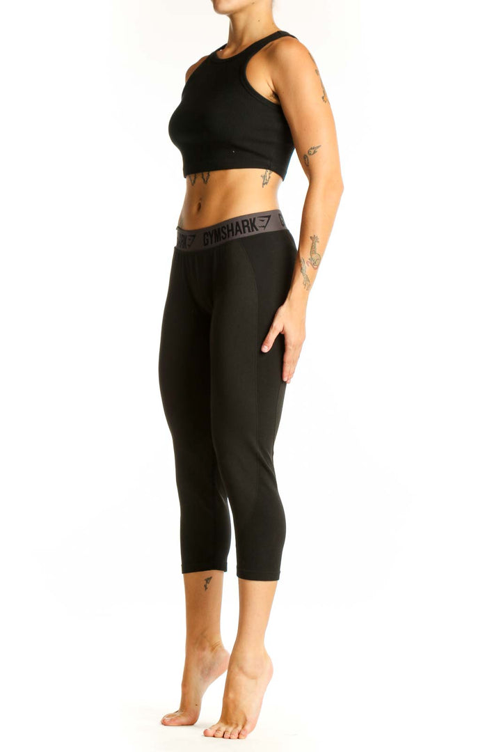 Front view of black Gymshark capri leggings with high waistband
