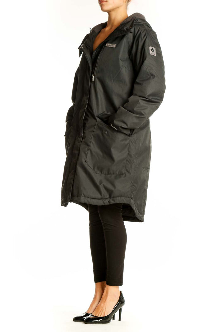 Front view of dark green Columbia winter coat with hood