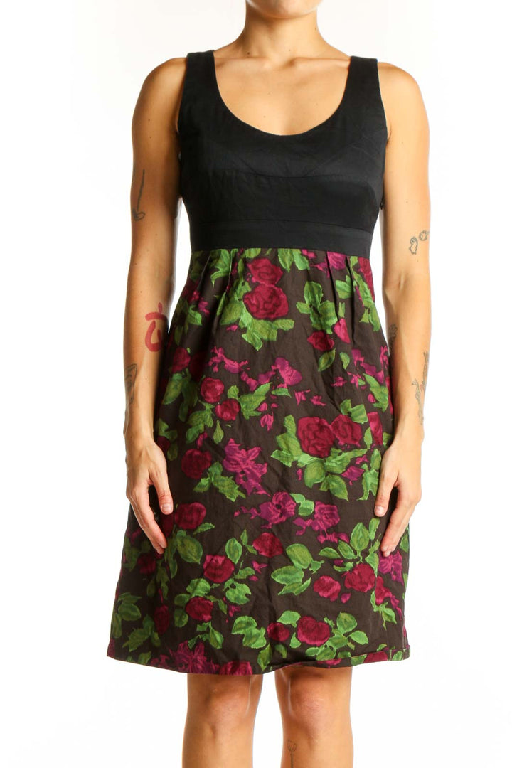 Front view of Moulinette Soeurs black dress with floral print skirt and empire waist