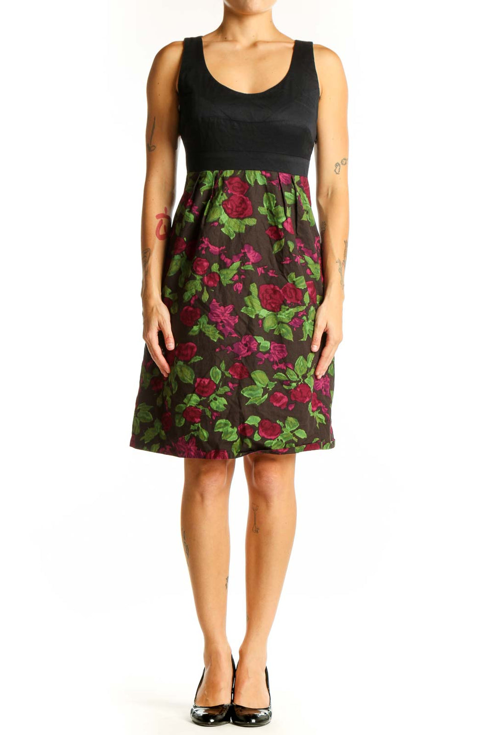 Front view of Moulinette Soeurs black dress with floral print skirt and empire waist